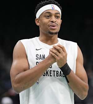 Nov 10, 2023; San Antonio, Texas, USA; San Antonio Spurs forward Keldon Johnson (3) enjoys a laugh before a game against the Minnesota Timberwolves at Frost Bank Center.